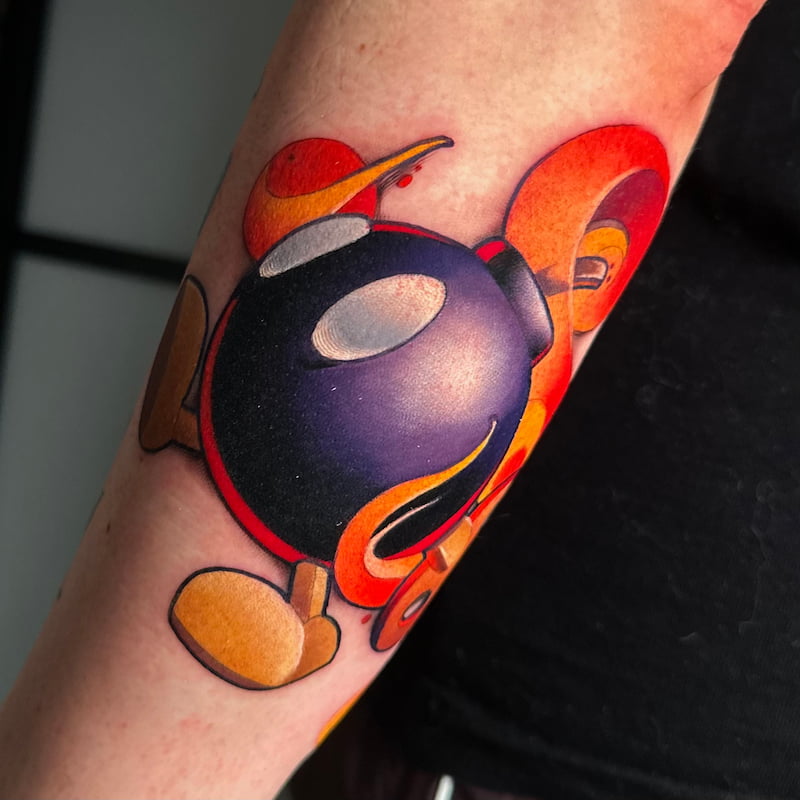 Color videogame tattoo by Sasha Akulov in Finland